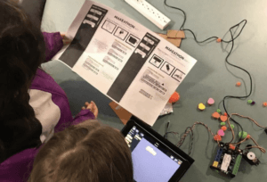 Students reading and working on robots in the library!