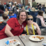 Families enjoying breakfast at a Read Across America event.